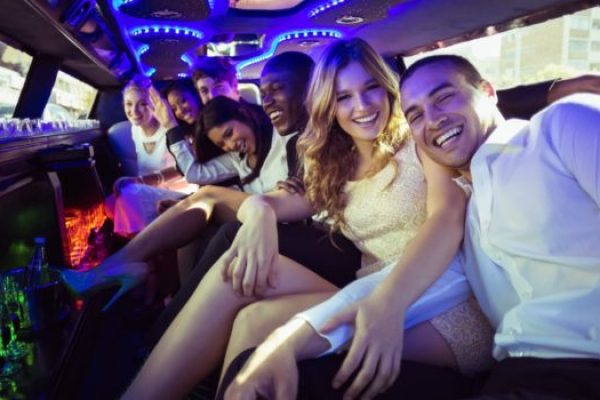 Happy-friends-chatting-in-limo-710x350